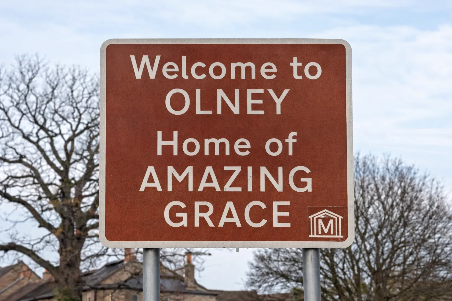 Welcome to Olney sign stating “Home of Amazing Grace” at the entrance to Olney, Buckinghamshire