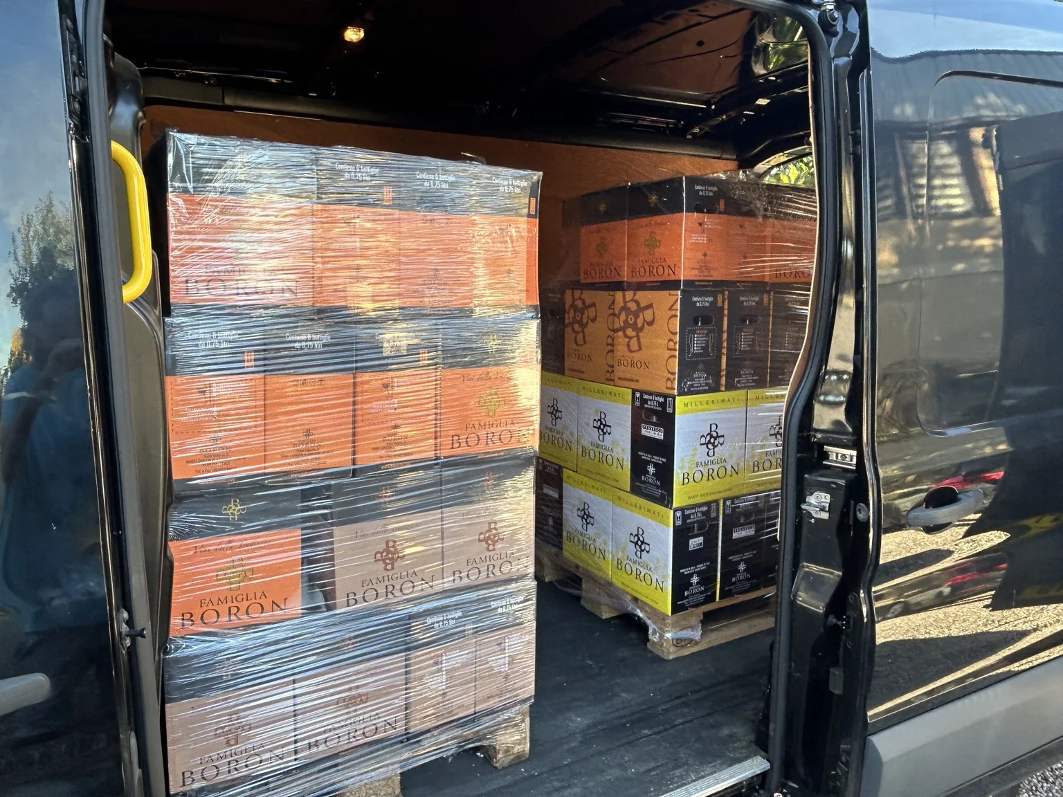 Two wrapped pallets of Famiglia Boron wine loaded into the Donzella Wines van at the winery